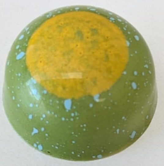 Coconut, lemon, lemongrass Ganache in a white chocolate shell.