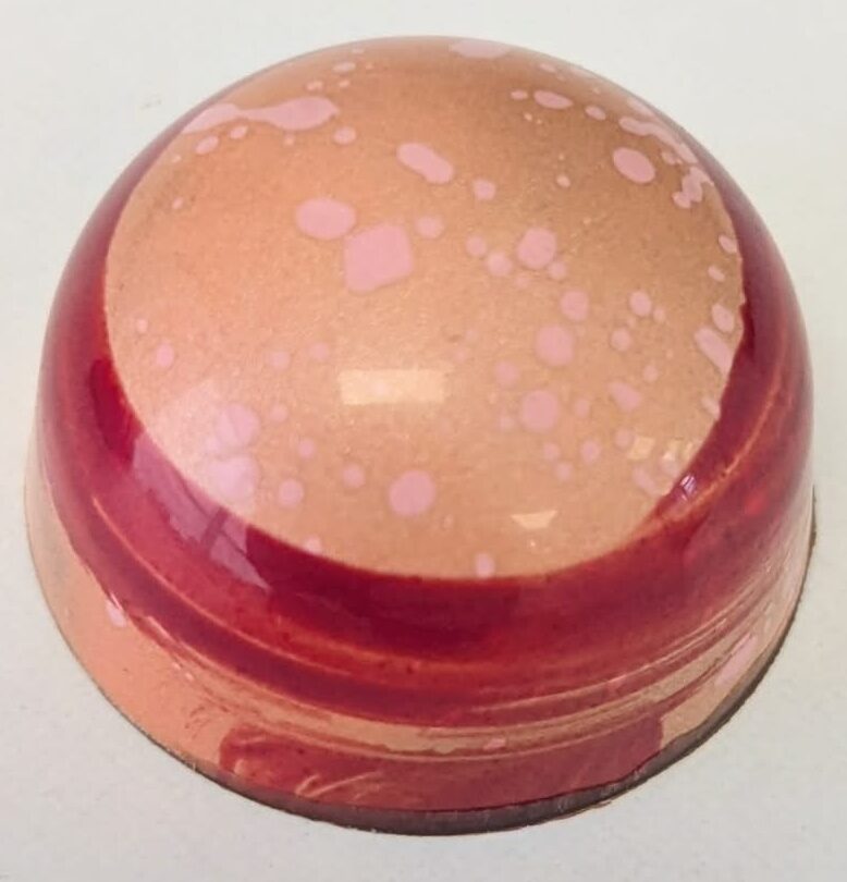 Raspberry passion fruit in a 54% dark chocolate shell
