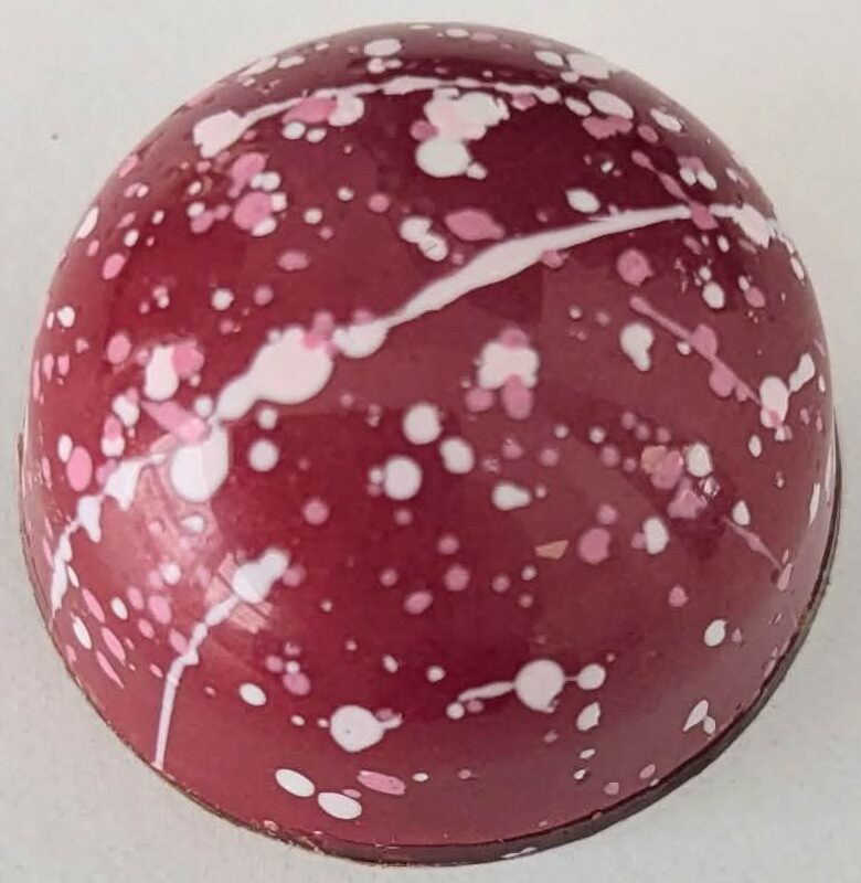 Caramel donut in a 54% dark chocolate shell.